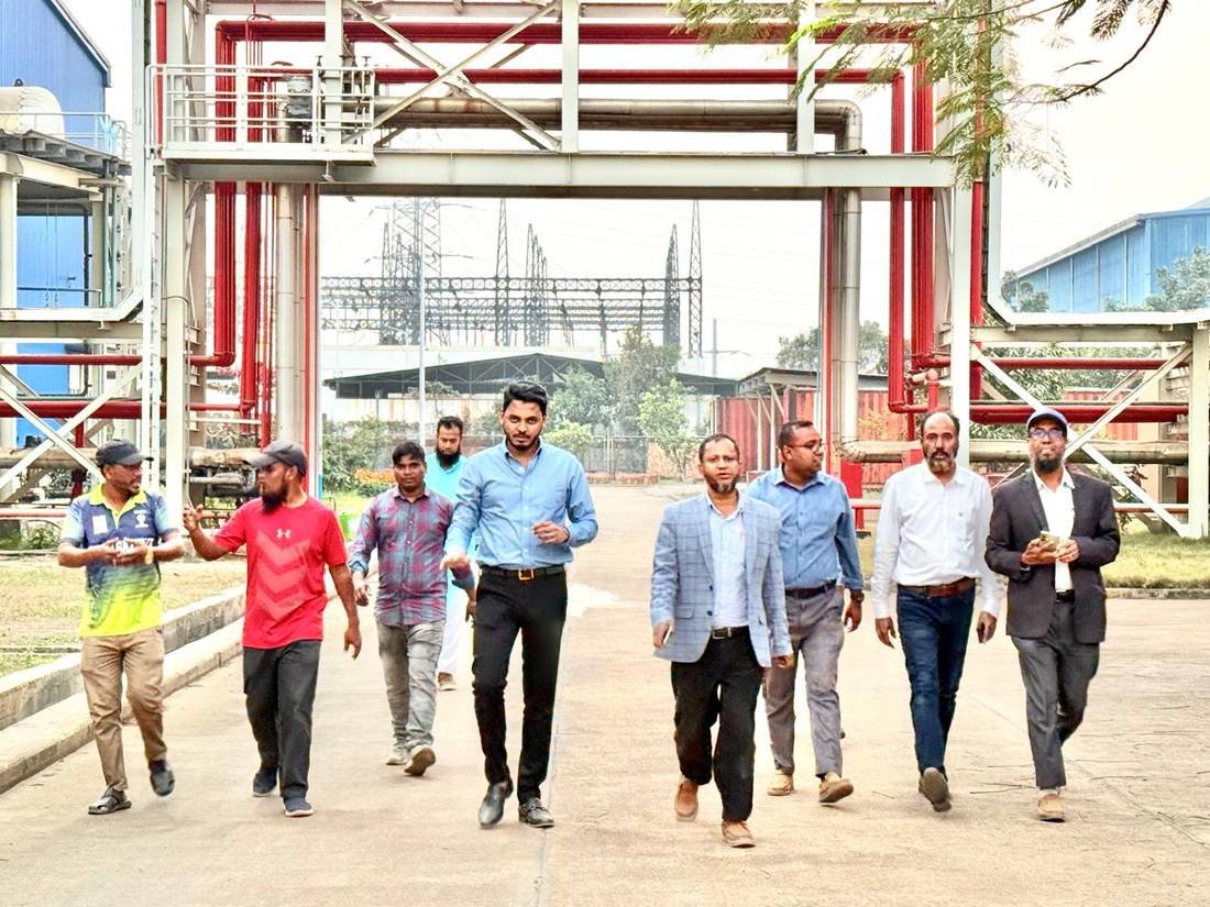 R. M. Corporation team walking a power plant site with project engineers