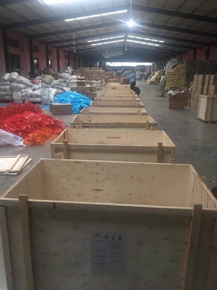 Crates of imported equipment in a warehouse