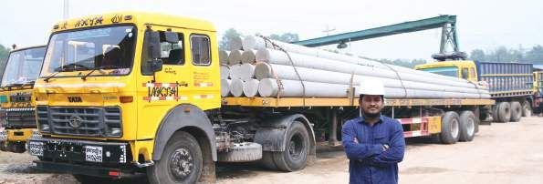 Trailer truck loaded with concrete poles